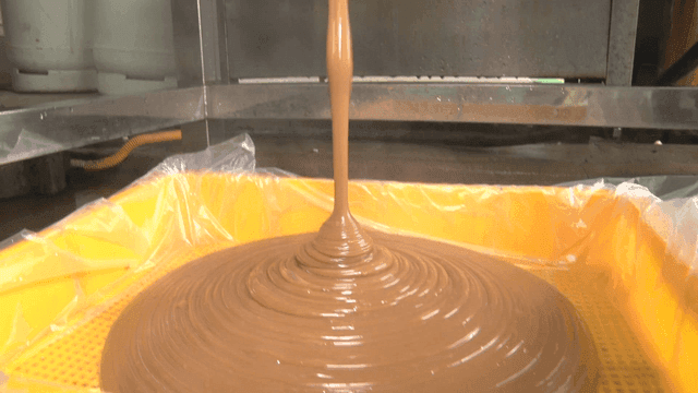 Acorn jelly coming out of a machine