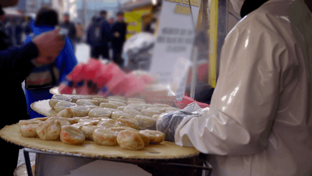 Vendor selling steamed dumplings on street