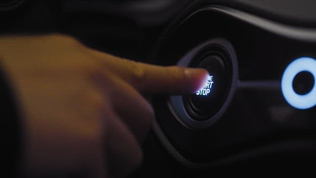 Pushing Car's Engine Start-Stop Button