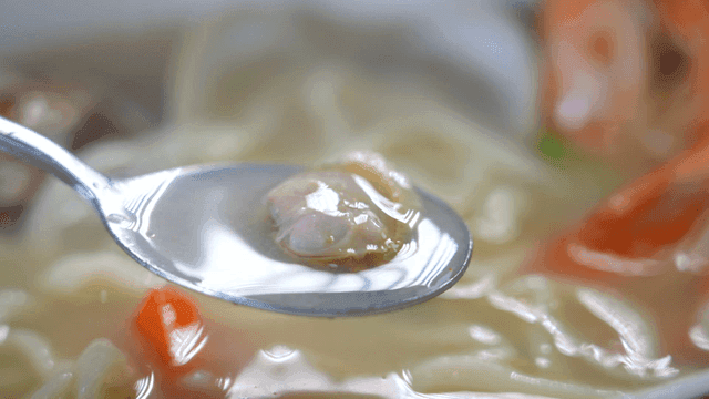 Spoonful of clam noodle soup