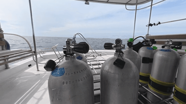 Scuba tanks on a boat with ocean view