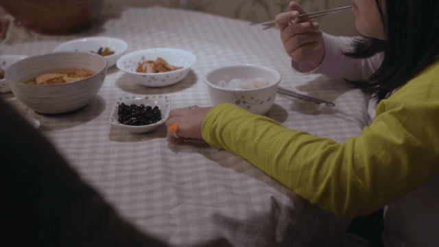 Child eating with a ring on his hand