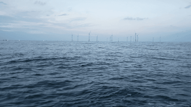 Wind turbines on the ocean horizon