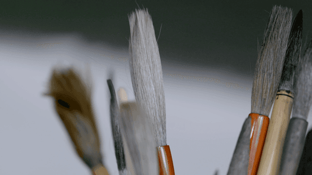 Various paintbrushes in a holder
