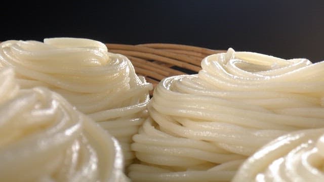 Freshly cooked noodles in a basket