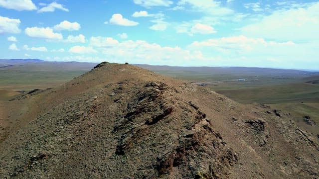 Expansive mountain landscape under a blue sky