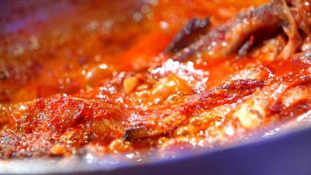 Steamed fish containing various fish simmering in a pot