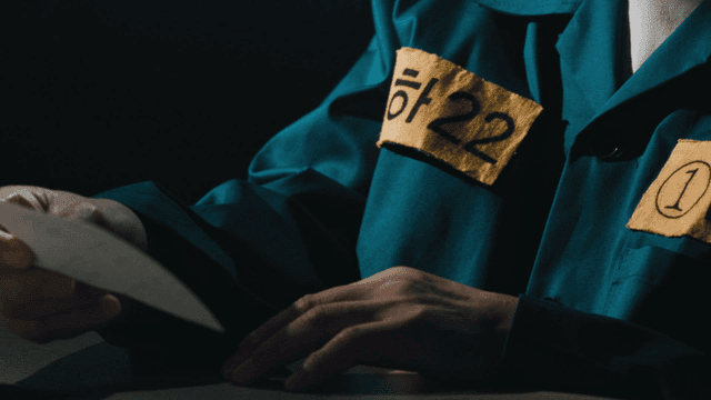 Prisoner looking at photos