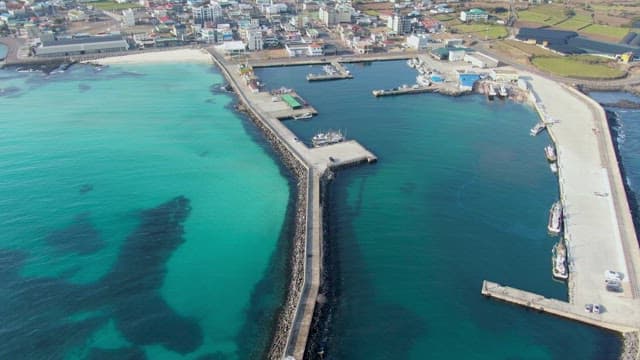 Coastal city with a pier and clear sea