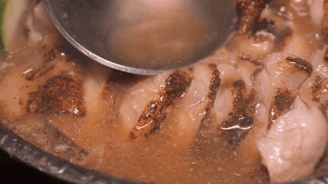 Chicken in chicken stew boiling in broth