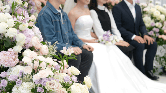 Bride poses for photos with her guests.
