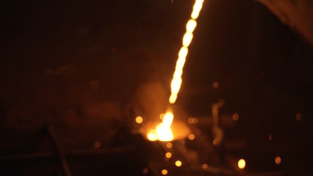 Molten metal pouring into a mold