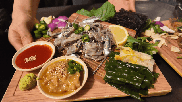 Generous portion of raw anchovies served