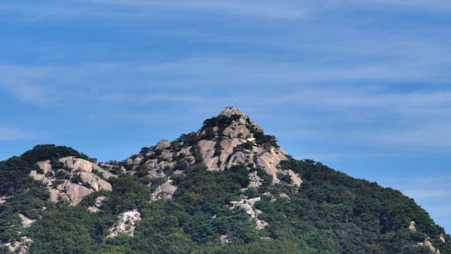 Buramsan mountain peak with a clear blue sky