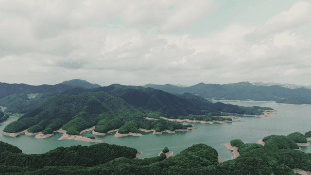 Vast lake surrounded by lush mountains