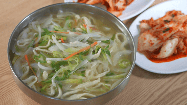 Hand-cut noodles served with kimchi