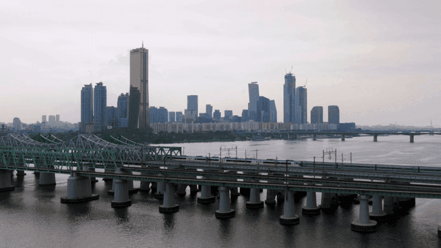 Bridges over river and city skyline.