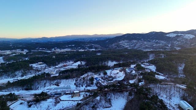 Snow-covered mountains at sunrise