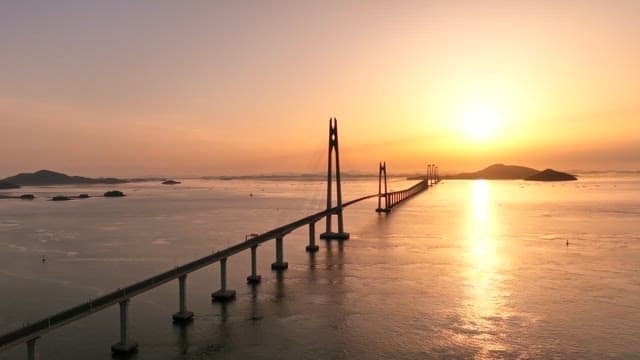 Bridge stretching over the sea at sunset