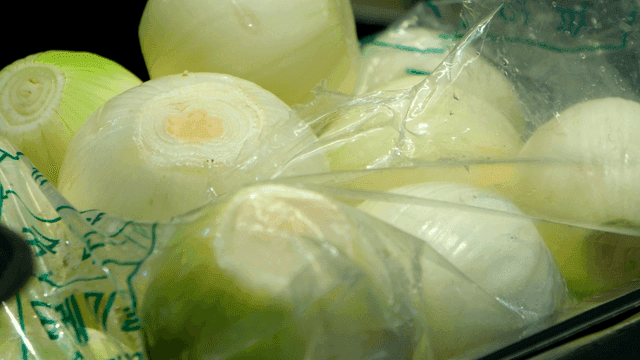 Fresh onions in a plastic bag