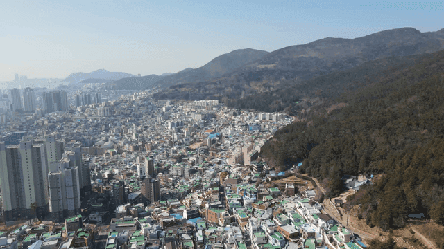 Sprawling cityscape with mountains
