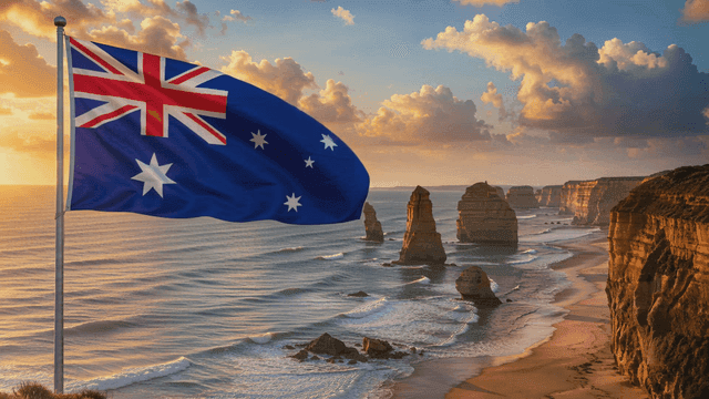 Australian flag waving by the ocean cliffs