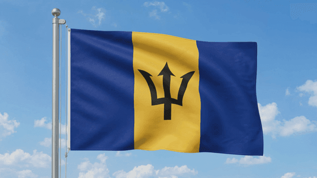 Barbados flag fluttering under clear sky