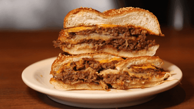 Juicy burger cross-section on white plate