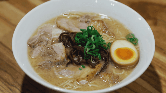 Bowl of rich ramen with char siu