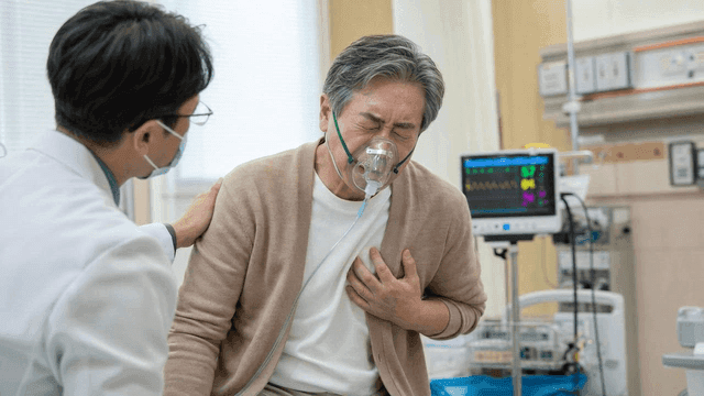 Elderly patient wearing oxygen mask in hospital