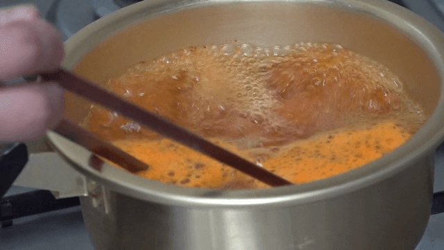Cooking ramen in a pot on a stove
