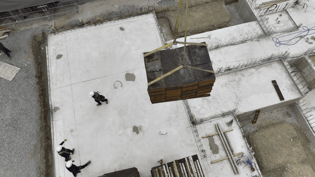 Construction site with a crane lifting materials