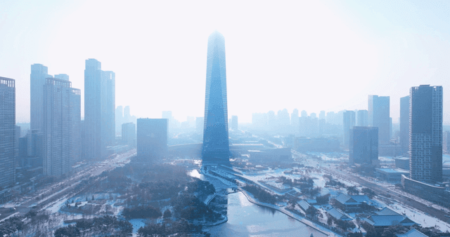 Snow-covered cityscape with tall buildings