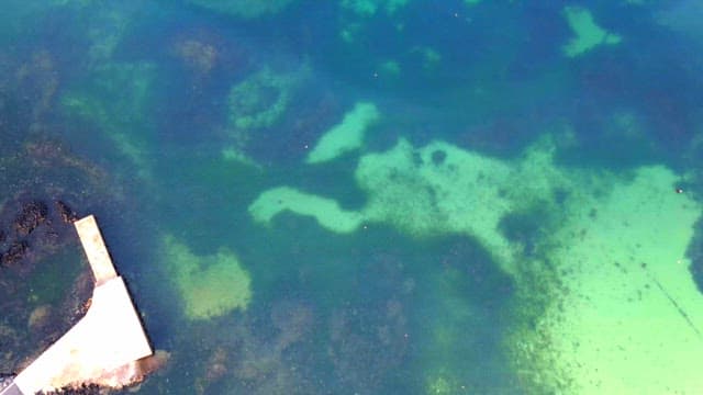 Calm turquoise sea with underwater formations