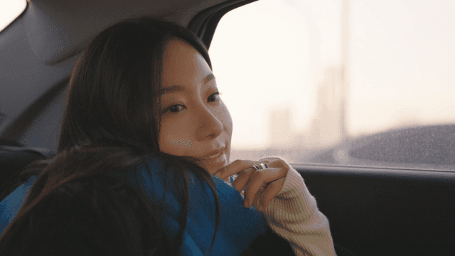 Woman gazing out of a taxi window