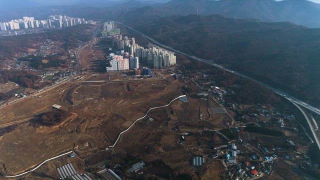 Sprawling Farmlands and Cities Beyond