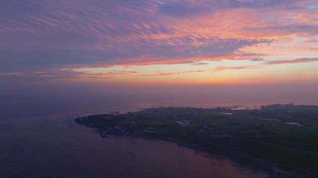 Serene coastal landscape at sunset