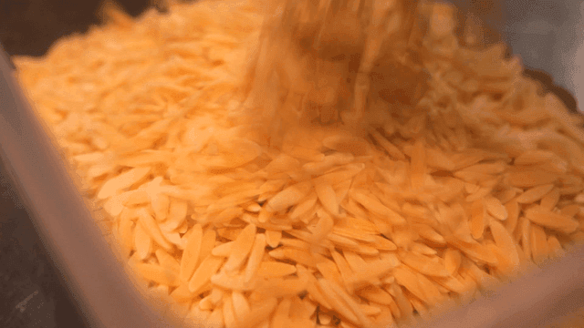 Pasta being poured into a container