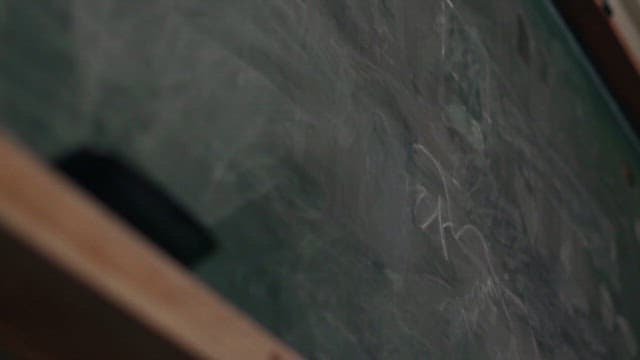 Chalk Falling and Breaking After Hitting the Blackboard