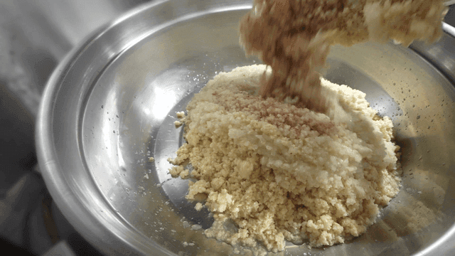 Minced garlic and pear poured into basin