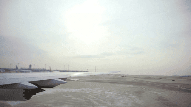 Airplane wing view at the airport