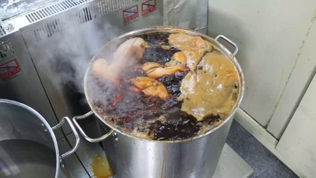 Soup boiling in a stainless steel pot