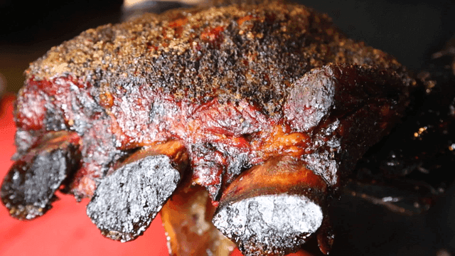 One piece of seasoned grilled Texas BBQ beef ribs