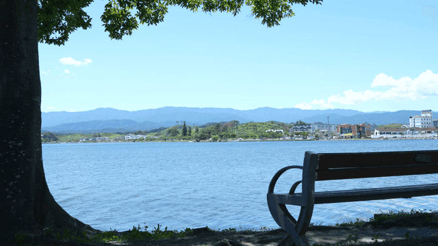 A peaceful lakeside view with mountains