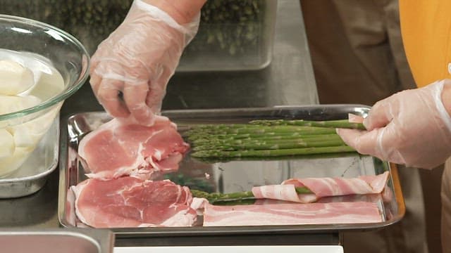 Asparagus Rolled into Thin-Sliced ​​Pork Belly in Kitchen