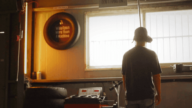 Back view looking out window in dark garage