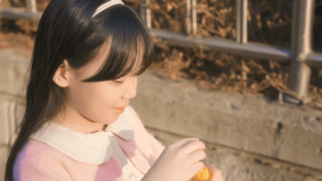 Child blowing bubbles outdoors