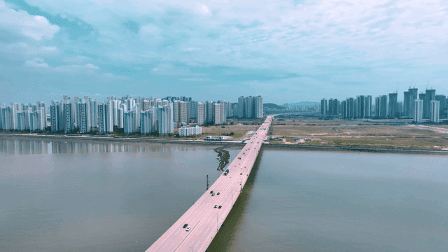 Wide bridge road leading to modern new city
