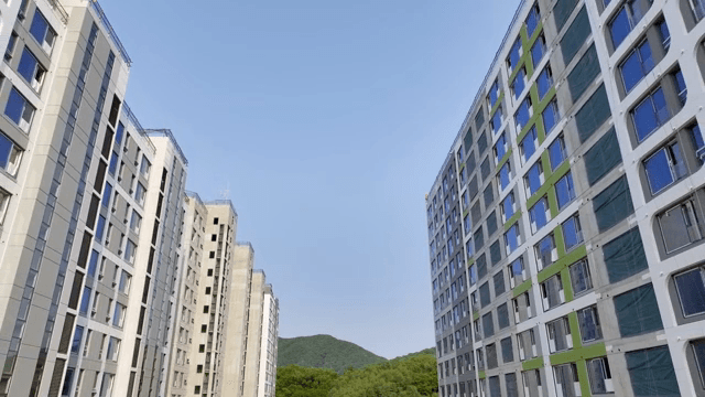 Tall apartment buildings with a mountain view