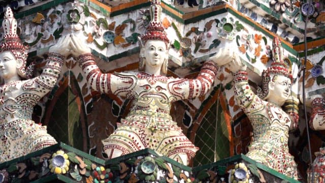 Elaborate sculptures decorate the exterior walls of Thai temple